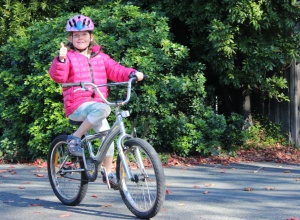 kids who ride bikes hollie thumbs up cycling goRide
